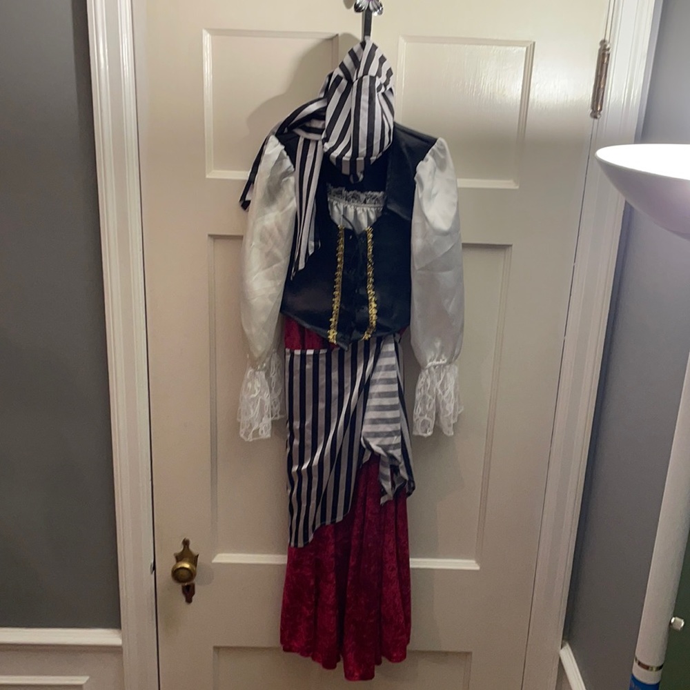 One of a kind girls approximate size medium PIRATE COSTUME.